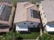 Aerial view showcasing a home with solar panels, patio, and artificial grass backyard at 10426 Mount Washington Ave, Las Vegas, NV 89166
