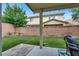 Lush backyard with artificial turf and covered patio, perfect for outdoor entertaining at 10426 Mount Washington Ave, Las Vegas, NV 89166