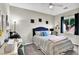 Cozy bedroom featuring stylish decor, comfortable bed, and a bright window for natural light at 10426 Mount Washington Ave, Las Vegas, NV 89166