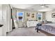 Bright bedroom with natural light, a dresser, and a full-length mirror reflecting outdoor views at 10426 Mount Washington Ave, Las Vegas, NV 89166