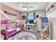 Cozy bedroom featuring a whimsical bed, ceiling fan, and well-organized shelving at 10426 Mount Washington Ave, Las Vegas, NV 89166