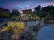 Well-lit community clubhouse at dusk, with inviting landscaping and desert plants at 10426 Mount Washington Ave, Las Vegas, NV 89166
