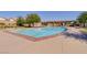 Community pool with ample lounge seating and a covered patio area at 10426 Mount Washington Ave, Las Vegas, NV 89166