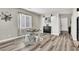 An open dining area features stylish décor, natural light, and seamless access to the kitchen and entryway at 10426 Mount Washington Ave, Las Vegas, NV 89166