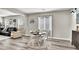 A stylish dining area showcasing an informal table setting, with views into the living room at 10426 Mount Washington Ave, Las Vegas, NV 89166