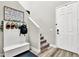 Inviting entryway with coat rack, bench seating, and staircase leading to the upper level at 10426 Mount Washington Ave, Las Vegas, NV 89166