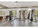 Community gym featuring weight lifting machines and mirrors at 10426 Mount Washington Ave, Las Vegas, NV 89166