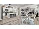 Open-concept living space with a dining area and a view into the kitchen, perfect for entertaining at 10426 Mount Washington Ave, Las Vegas, NV 89166