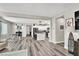 Spacious living area featuring an open concept design to dining and kitchen with light-colored floors at 10426 Mount Washington Ave, Las Vegas, NV 89166