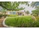Manicured backyard featuring green grass and landscaping at 1100 Cypress Ridge Ln, Las Vegas, NV 89144