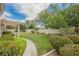 View of backyard with green grass, trees, and landscaping at 1100 Cypress Ridge Ln, Las Vegas, NV 89144