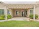 Backyard patio with pergola covering, lush landscaping, and peaceful ambiance at 1100 Cypress Ridge Ln, Las Vegas, NV 89144