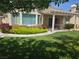 Lush backyard featuring a covered patio and colorful landscaping at 1100 Cypress Ridge Ln, Las Vegas, NV 89144
