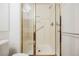 Bright bathroom featuring glass enclosed shower with gold trim and chrome hardware at 1100 Cypress Ridge Ln, Las Vegas, NV 89144