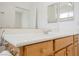Bathroom vanity with a large mirror, sink and wooden cabinets at 1100 Cypress Ridge Ln, Las Vegas, NV 89144