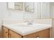 Bright bathroom featuring a white countertop vanity and mirrored cabinet at 1100 Cypress Ridge Ln, Las Vegas, NV 89144
