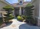 Inviting front entrance with meticulously manicured topiaries and a well-maintained walkway at 1100 Cypress Ridge Ln, Las Vegas, NV 89144