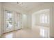 Spacious foyer with a glass double door entry and an arched doorway leading to a dining area at 1100 Cypress Ridge Ln, Las Vegas, NV 89144