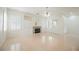 Bright, open living room with a fireplace, built-in cabinets, and plantation shutters at 1100 Cypress Ridge Ln, Las Vegas, NV 89144
