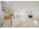 Bright living space featuring a fireplace, wood floors, and an open kitchen layout at 1100 Cypress Ridge Ln, Las Vegas, NV 89144