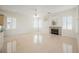 Spacious living room with a fireplace, built-in shelves, and plantation shutters for natural light at 1100 Cypress Ridge Ln, Las Vegas, NV 89144
