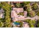 Aerial view of a sprawling custom estate, boasting a pool, pristine landscaping, and manicured lawns at 12056 Royal Dolnoch Ct, Las Vegas, NV 89141