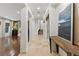 Bright foyer featuring tile flooring, decorative columns, and an eye-catching piece of art at 12056 Royal Dolnoch Ct, Las Vegas, NV 89141