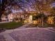 Charming single-story home with stone facade, well-manicured landscaping, and inviting curb appeal at 12056 Royal Dolnoch Ct, Las Vegas, NV 89141