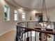 Hallway features a curved railing, recessed lighting, and access to various rooms at 12056 Royal Dolnoch Ct, Las Vegas, NV 89141