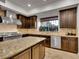 Well-equipped kitchen with a large island, stainless steel appliances, and custom cabinetry at 12056 Royal Dolnoch Ct, Las Vegas, NV 89141