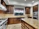 Well-equipped kitchen featuring granite countertops, stainless steel appliances and ample cabinet space at 12056 Royal Dolnoch Ct, Las Vegas, NV 89141