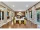 Spacious living room with hardwood floors and an open layout leading to outdoor spaces at 12056 Royal Dolnoch Ct, Las Vegas, NV 89141