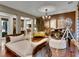 Elegant living room showcasing a piano, chandelier, and stylish furnishings at 12056 Royal Dolnoch Ct, Las Vegas, NV 89141