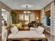 Stylish living room features a piano, chandelier, and elegant furniture at 12056 Royal Dolnoch Ct, Las Vegas, NV 89141