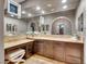 Chic main bathroom with custom vanity, large mirror, and plenty of storage space at 12056 Royal Dolnoch Ct, Las Vegas, NV 89141