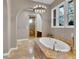 Luxurious main bathroom with a standalone tub, walk-in shower, and modern fixtures at 12056 Royal Dolnoch Ct, Las Vegas, NV 89141