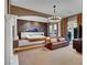 Spacious main bedroom with sitting area, custom lighting, and luxurious finishes at 12056 Royal Dolnoch Ct, Las Vegas, NV 89141