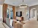 Luxurious main bedroom with a cozy seating area and direct access to the outdoor area at 12056 Royal Dolnoch Ct, Las Vegas, NV 89141