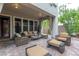 Covered patio featuring outdoor seating with decorative pillows, offering a comfortable space for entertaining at 12056 Royal Dolnoch Ct, Las Vegas, NV 89141