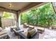 Inviting outdoor patio with stylish wicker furniture, creating a relaxing lounge area at 12056 Royal Dolnoch Ct, Las Vegas, NV 89141