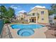 Backyard with a pool, spa, and patio, perfect for outdoor entertaining and relaxation with a well-maintained landscape at 1221 Diamond Valley St, Henderson, NV 89052