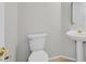 Elegant half-bathroom featuring a pedestal sink and neutral tones at 1221 Diamond Valley St, Henderson, NV 89052