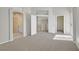 Spacious bedroom with neutral carpet, multiple doors and natural light at 1221 Diamond Valley St, Henderson, NV 89052