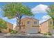 Charming two-story home featuring a well-manicured front yard and attached two-car garage at 1221 Diamond Valley St, Henderson, NV 89052