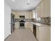 Well-lit kitchen features stainless steel appliances, and tile backsplash at 1221 Diamond Valley St, Henderson, NV 89052