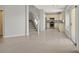 Open-concept living space featuring an adjacent kitchen with stainless steel appliances at 1221 Diamond Valley St, Henderson, NV 89052