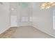 Bright living room with high ceilings, large windows, and a neutral color palette at 1221 Diamond Valley St, Henderson, NV 89052