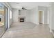 Cozy living room featuring a fireplace, tile flooring, and sliding glass doors to the backyard at 1221 Diamond Valley St, Henderson, NV 89052