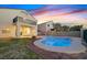 Backyard features a sparkling swimming pool, lawn, and an open patio at 1221 Diamond Valley St, Henderson, NV 89052