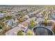 Bird's-eye view of a tranquil residential area showcasing well-spaced homes and lush landscaping on a sunny day at 1287 Dove Tree Ct, Henderson, NV 89014